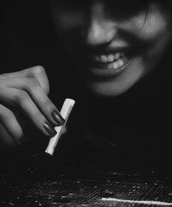 woman holding a blunt 1089423